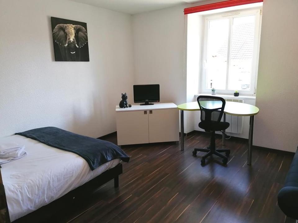 Posteľ alebo postele v izbe v ubytovaní Immeuble Meroux Moval