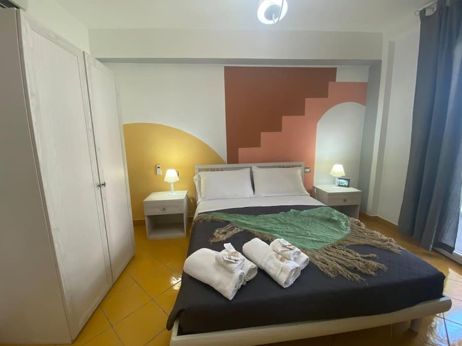 Voodi või voodid majutusasutuse Postino Rooms toas