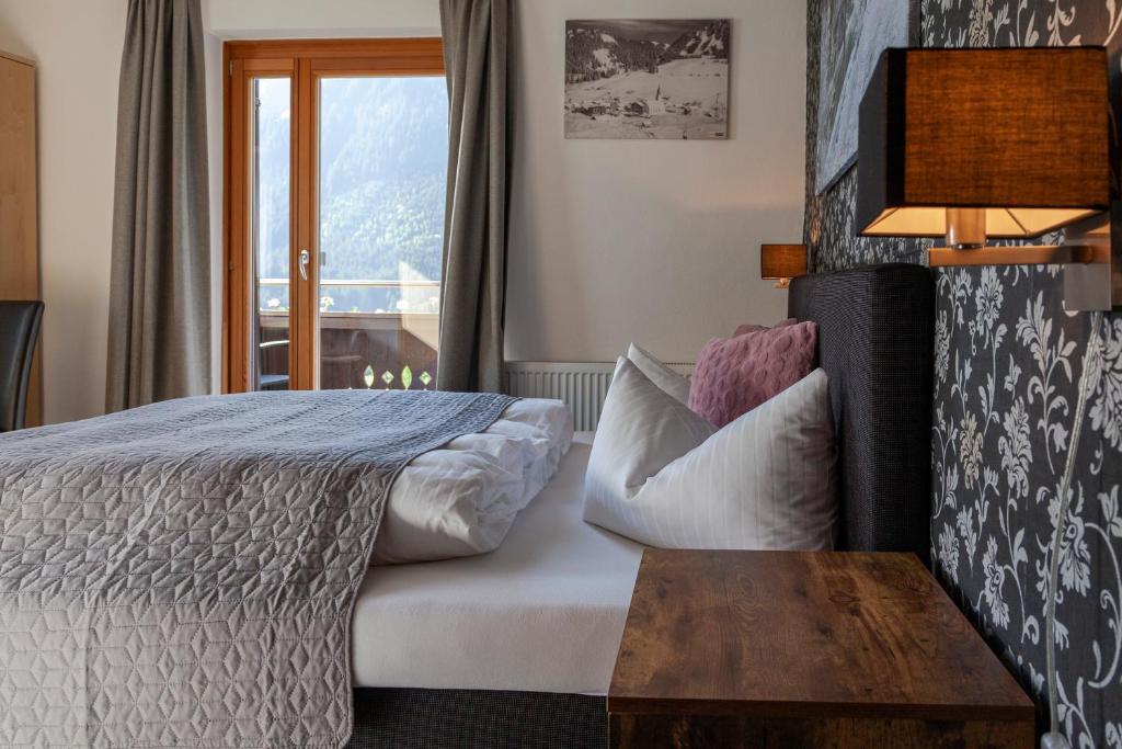 Postel nebo postele na pokoji v ubytování Berghotel TheLounge