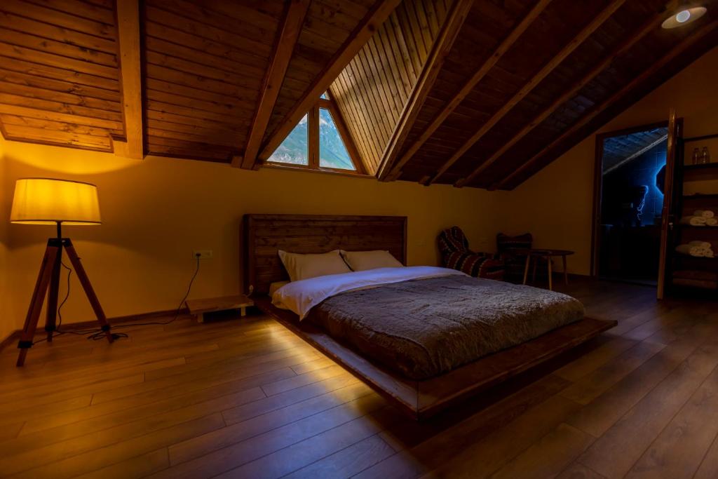 A bed or beds in a room at GRAF Kazbegi