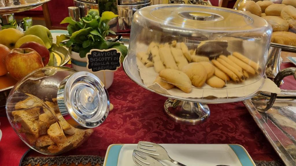 a display of food in a dish on a table at Art Hotel Orologio in Bologna