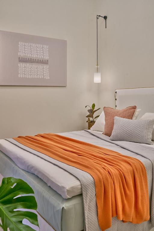 Łóżko lub łóżka w pokoju w obiekcie Voya Sifnos Mindful Stay