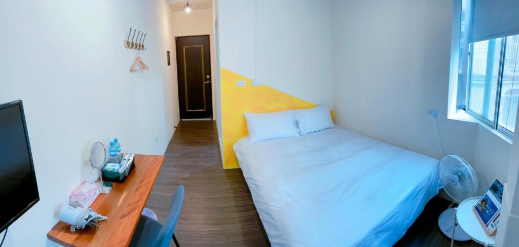Letto o letti in una camera di 好客輕旅