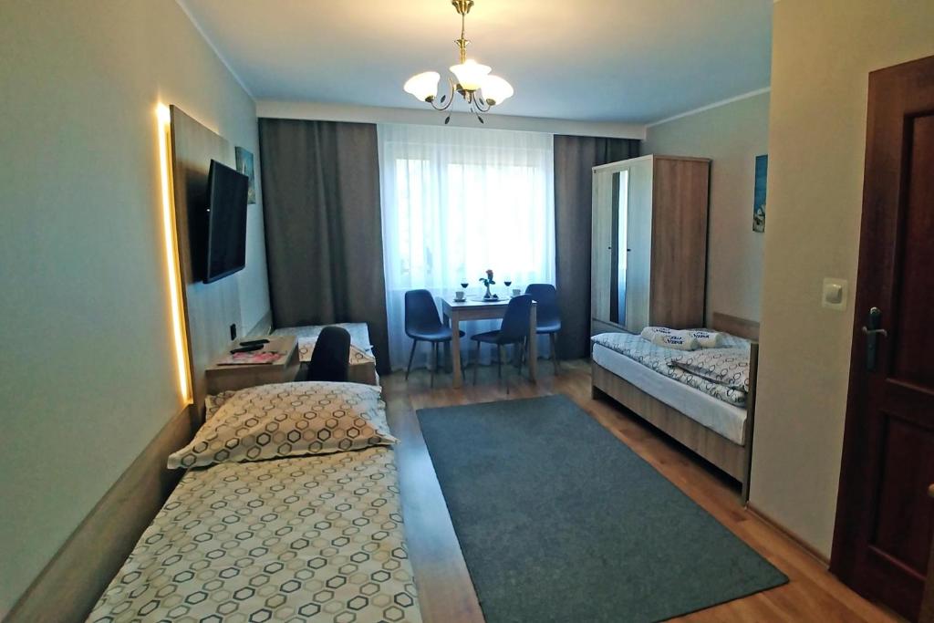 Postel nebo postele na pokoji v ubytování Willa Sternik