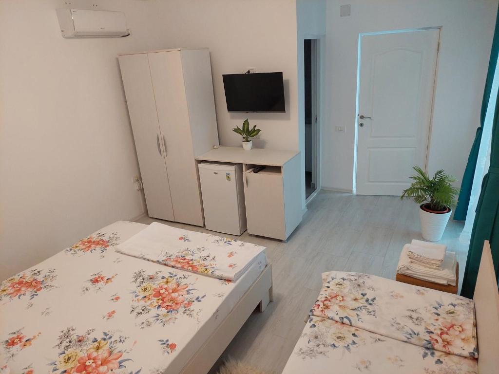 Postel nebo postele na pokoji v ubytování Casa AnaMaria