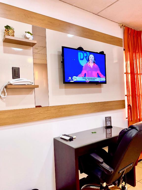 TV a/nebo společenská místnost v ubytování Hotel Madrigal