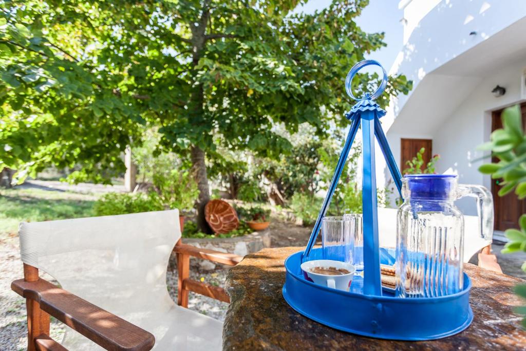 a blue lantern sitting on top of a table at Platanakia in Skopelos Town