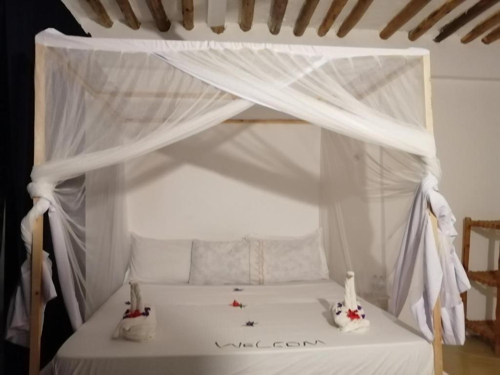 Postel nebo postele na pokoji v ubytování Babalao Rooftop Hotel