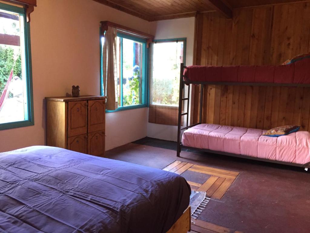 Uma cama ou camas num quarto em Hostel Raíz