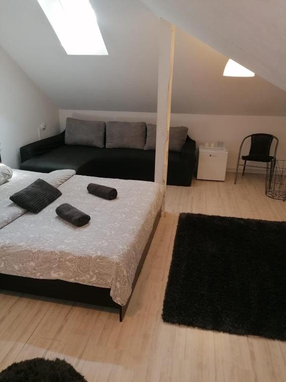 Postel nebo postele na pokoji v ubytování Vila ANA