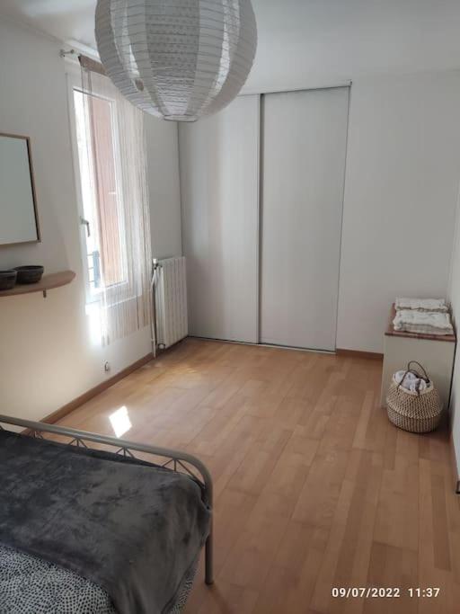 Postel nebo postele na pokoji v ubytování La Vigneronne du 7
