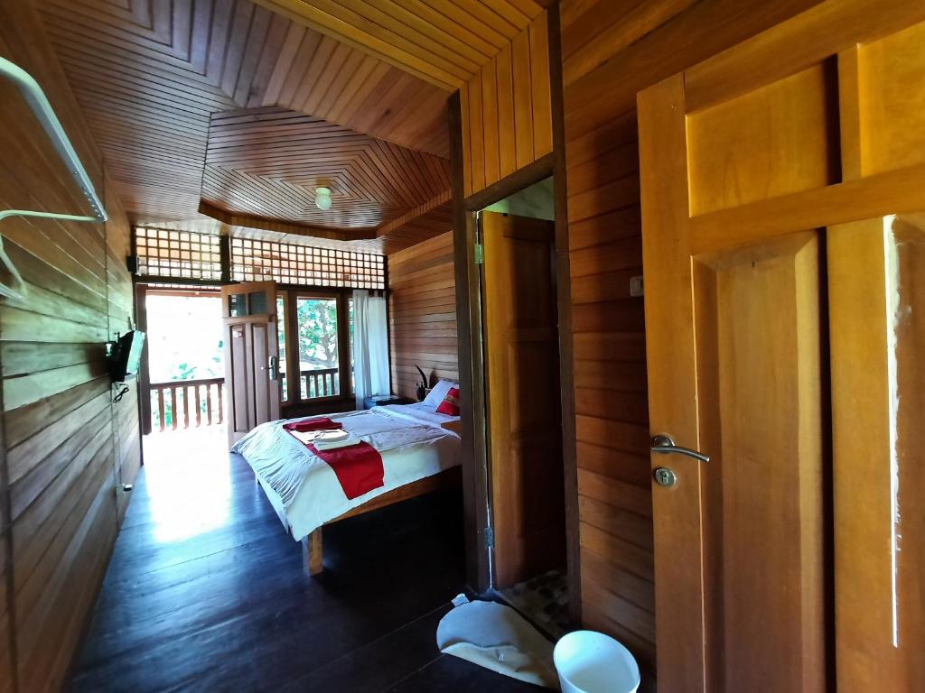 Postel nebo postele na pokoji v ubytování HOTEL BESAR BULAN BARU - Senggigi