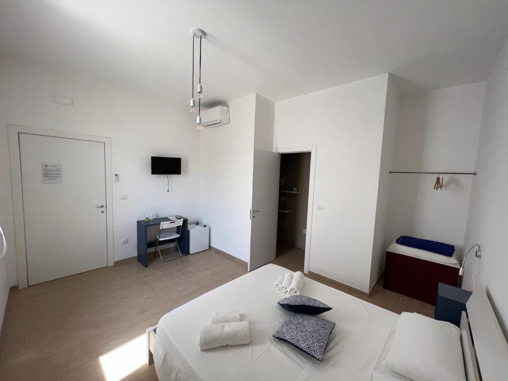 Postel nebo postele na pokoji v ubytování B&B EVO Nardò