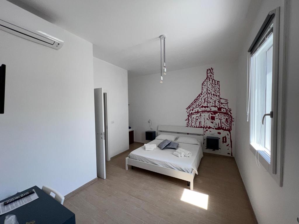 Postel nebo postele na pokoji v ubytování B&B EVO Nardò