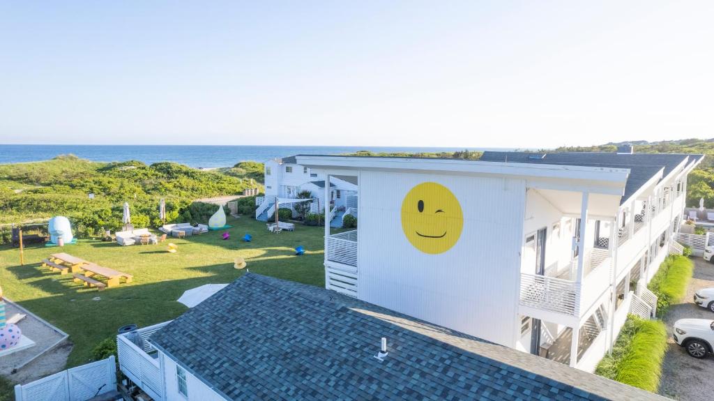 a building with a smiley face drawn on it at Hero Beach Club in Montauk