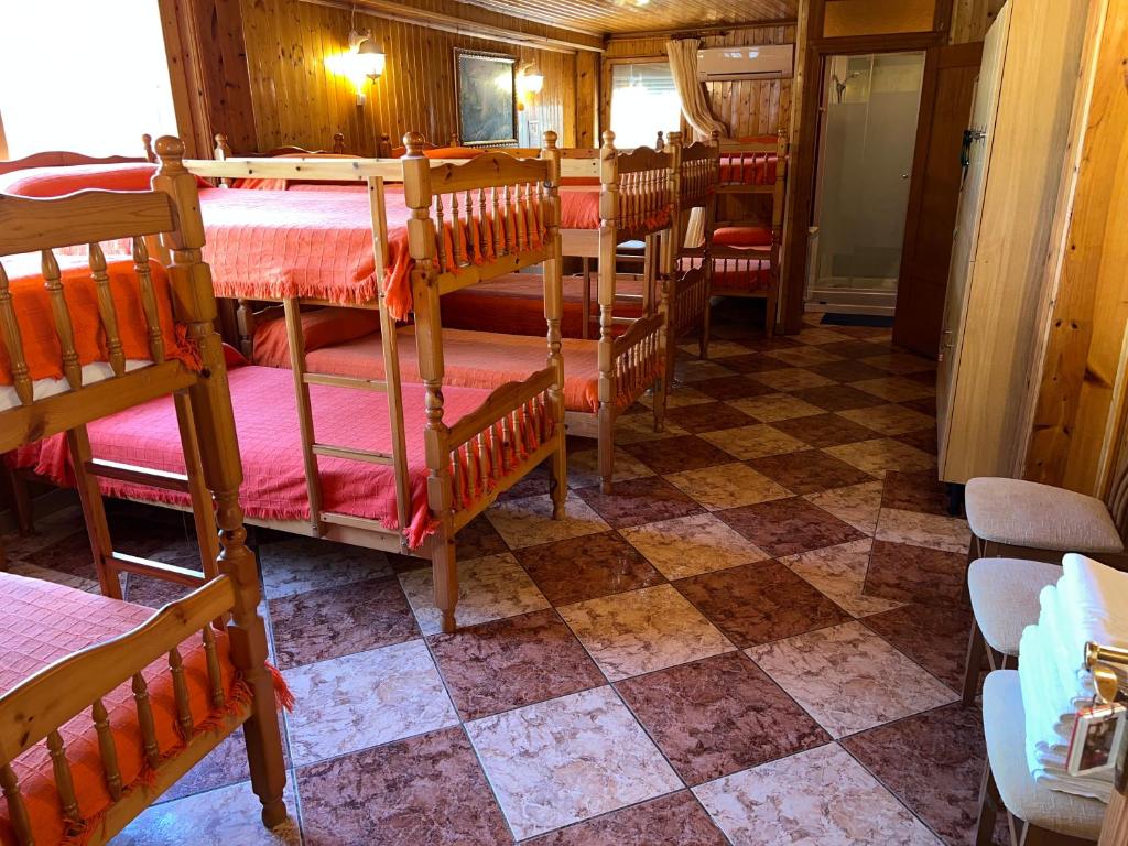 Cama o camas de una habitación en Bungalows & Albergue La Playa