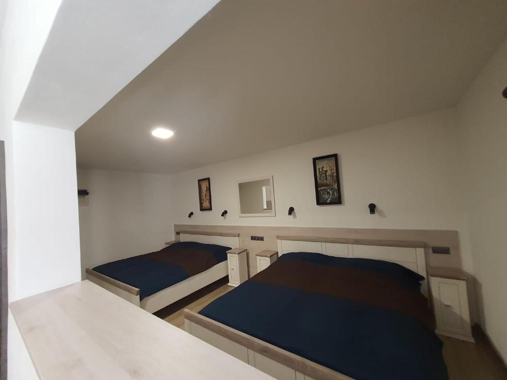 Postel nebo postele na pokoji v ubytování Penzion TOŠA