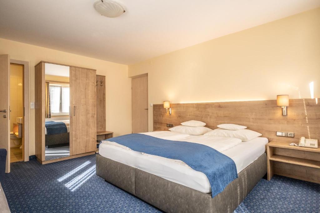 Un ou plusieurs lits dans un hébergement de l'établissement Hotel-Pension Falkensteiner