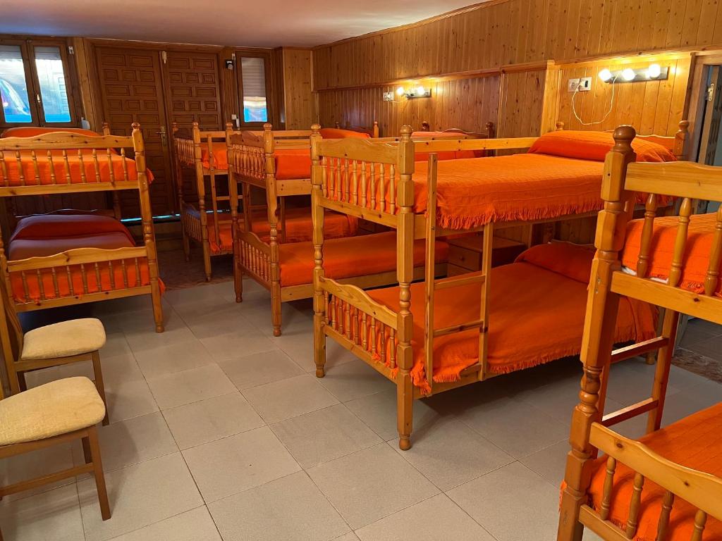 Cama o camas de una habitación en Bungalows & Albergue La Playa