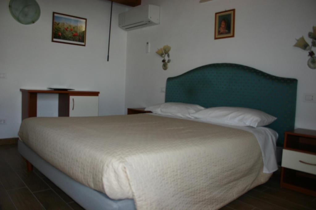 Posteľ alebo postele v izbe v ubytovaní A casa di Giò