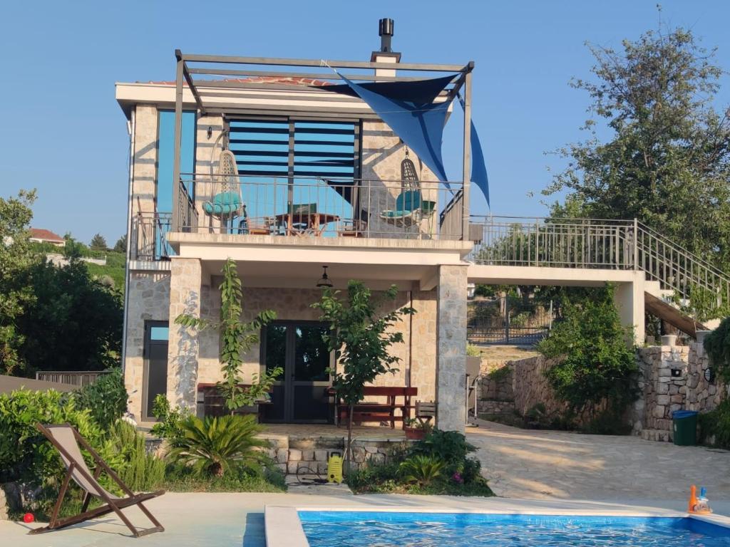 a villa with a swimming pool and a house at Stone Villa UK - Dobra Voda in Bar