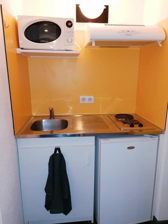 Kuchyňa alebo kuchynka v ubytovaní Immeuble Meroux Moval