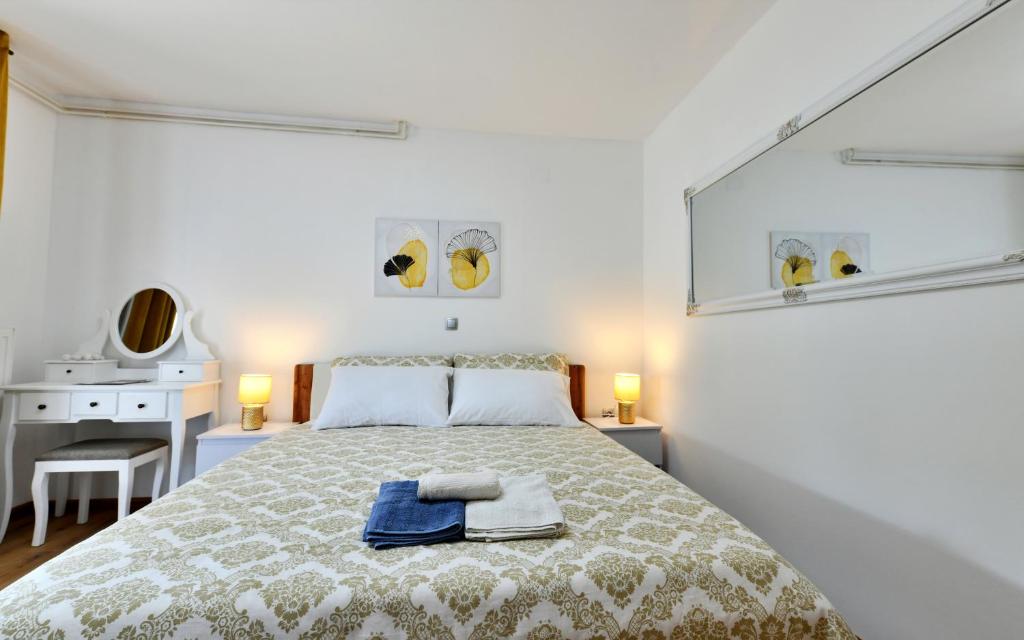 Posteľ alebo postele v izbe v ubytovaní Apartmani Brium