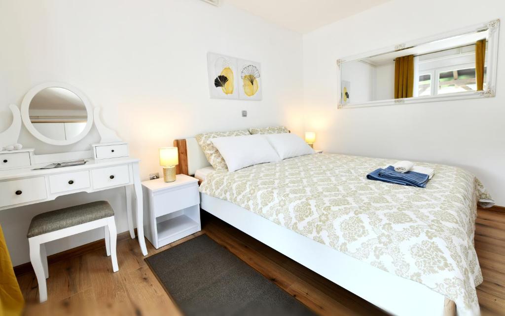 Posteľ alebo postele v izbe v ubytovaní Apartmani Brium