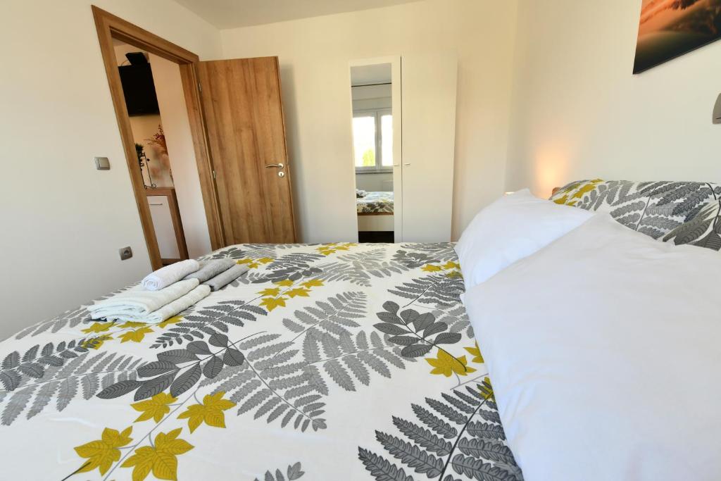 Posteľ alebo postele v izbe v ubytovaní Apartmani Brium