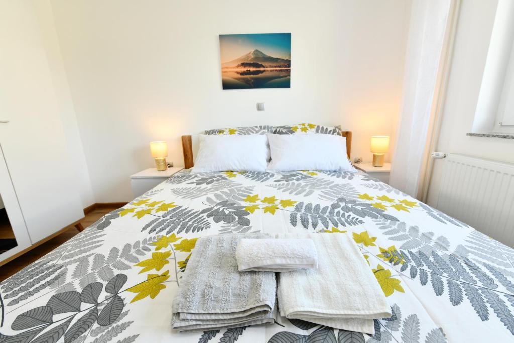 Posteľ alebo postele v izbe v ubytovaní Apartmani Brium