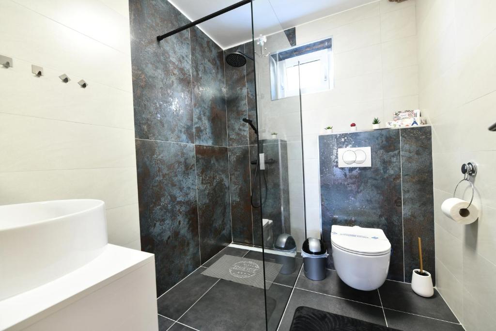 Kúpeľňa v ubytovaní Apartmani Brium