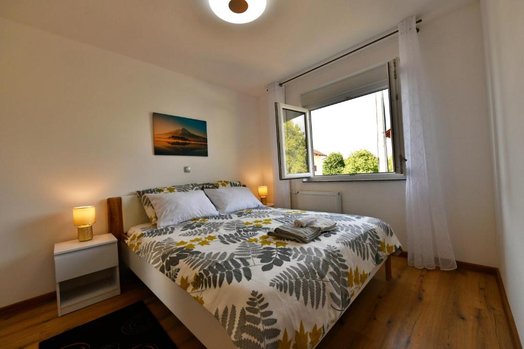 Posteľ alebo postele v izbe v ubytovaní Apartmani Brium