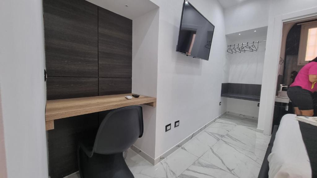 TV a/nebo společenská místnost v ubytování Rooms Vico Giunti
