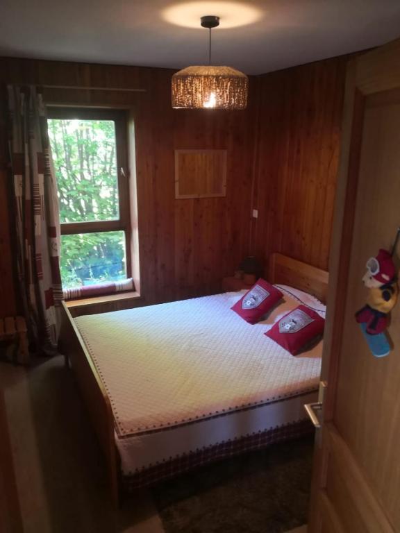 Postel nebo postele na pokoji v ubytování le chalet pointu de capucine