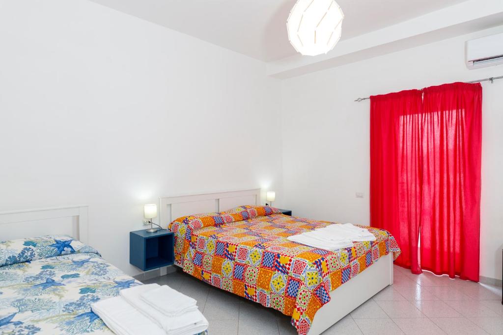 Postel nebo postele na pokoji v ubytování La Casa sul Faro