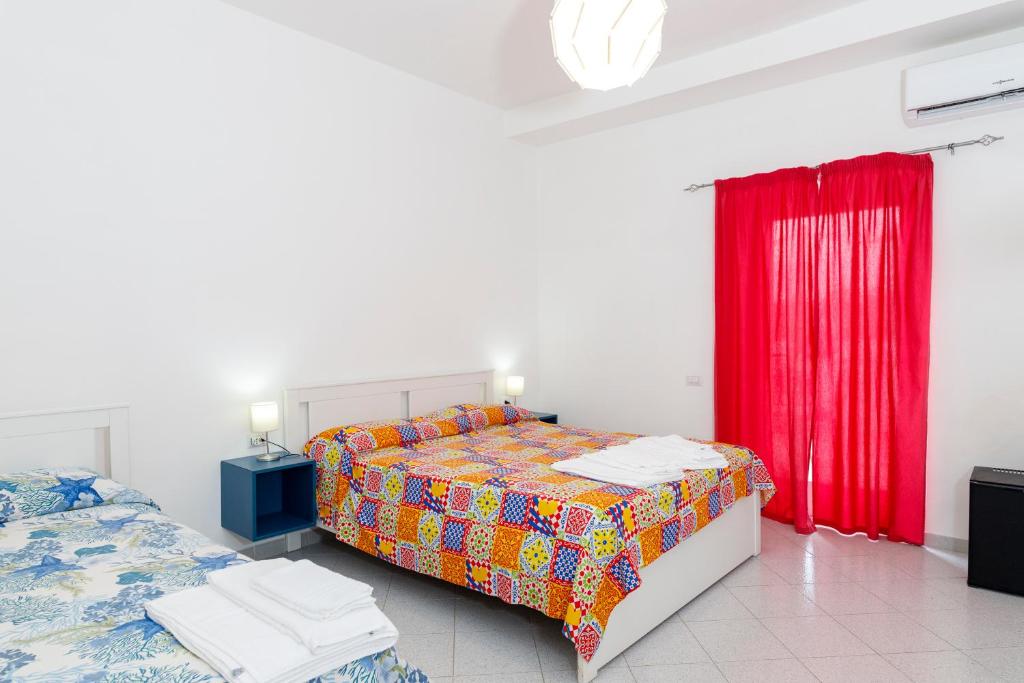 Postel nebo postele na pokoji v ubytování La Casa sul Faro