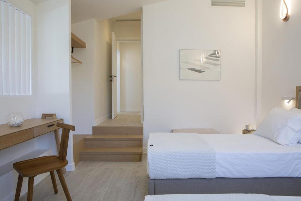 Łóżko lub łóżka w pokoju w obiekcie THE QUAD Luxury Villas