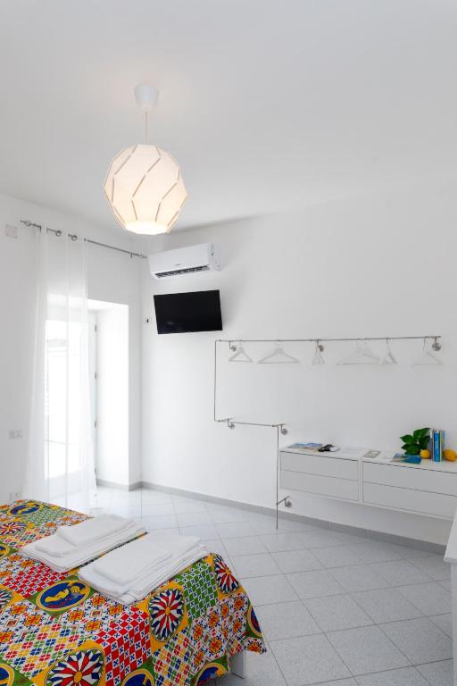 Postel nebo postele na pokoji v ubytování La Casa sul Faro