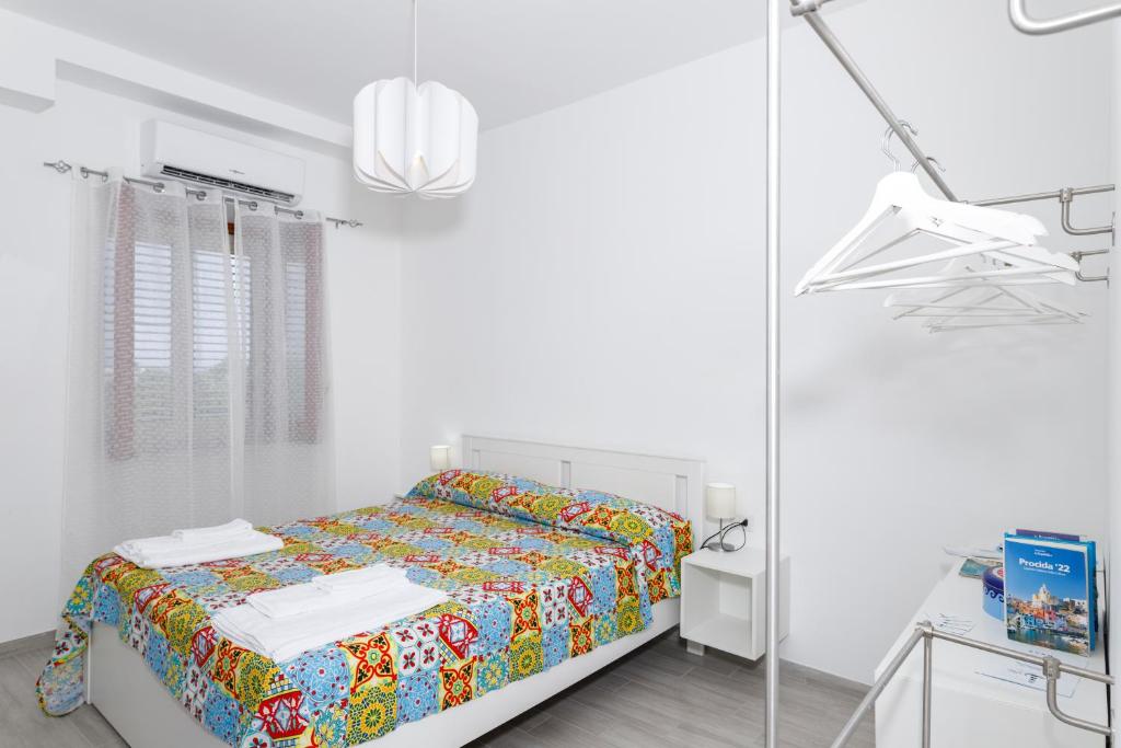 Postel nebo postele na pokoji v ubytování La Casa sul Faro