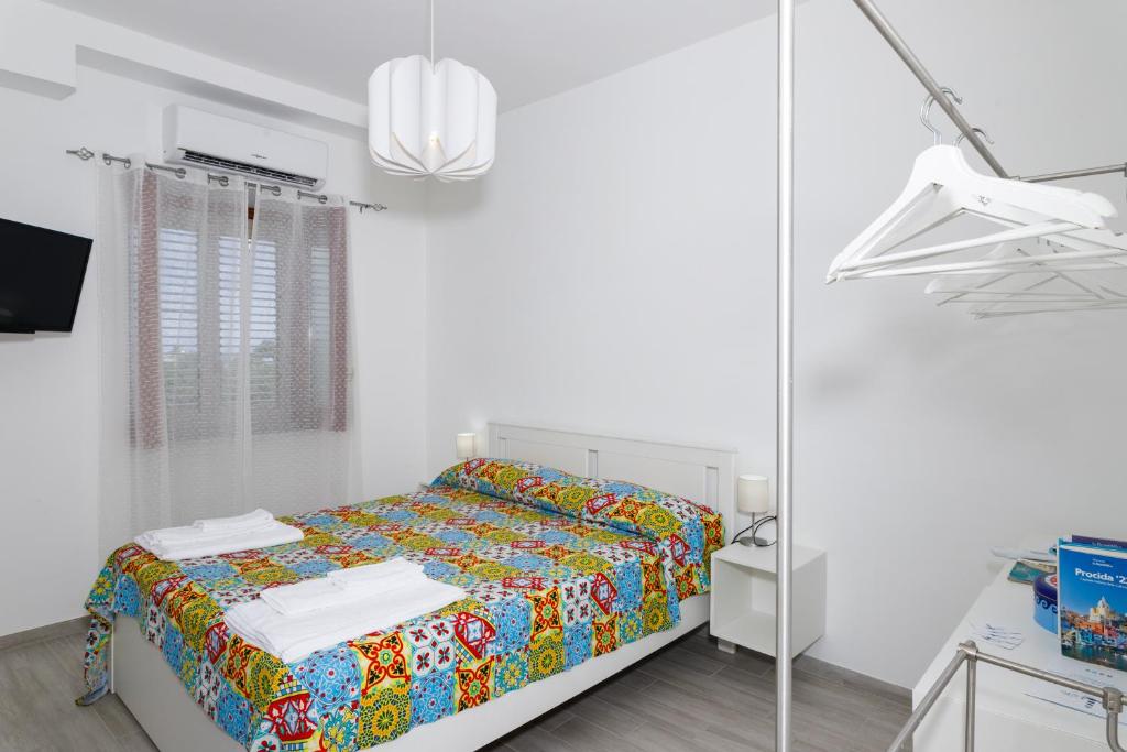 Postel nebo postele na pokoji v ubytování La Casa sul Faro