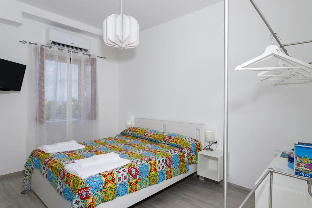 Postel nebo postele na pokoji v ubytování La Casa sul Faro
