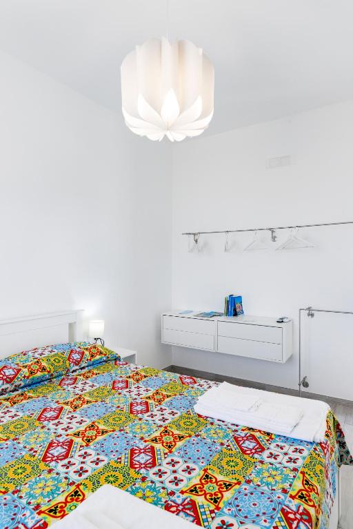 Postel nebo postele na pokoji v ubytování La Casa sul Faro