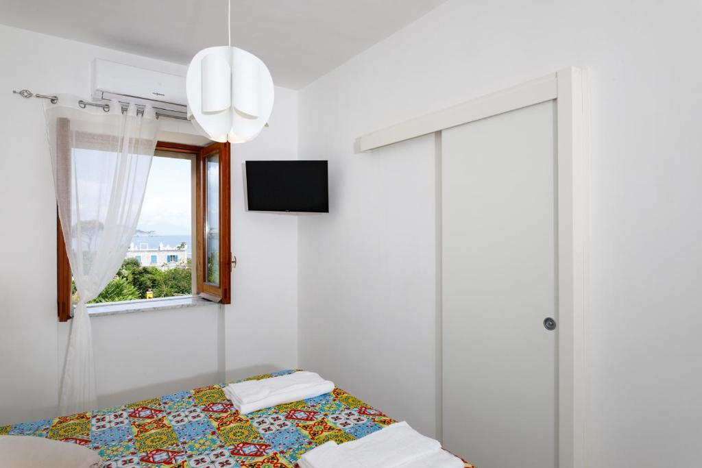 Postel nebo postele na pokoji v ubytování La Casa sul Faro