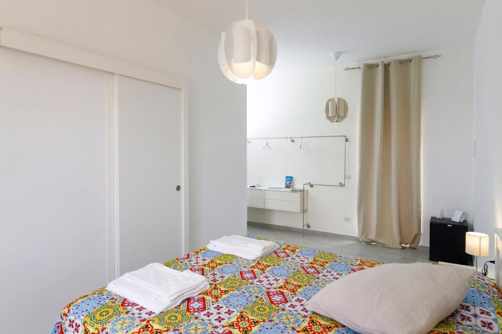 Postel nebo postele na pokoji v ubytování La Casa sul Faro