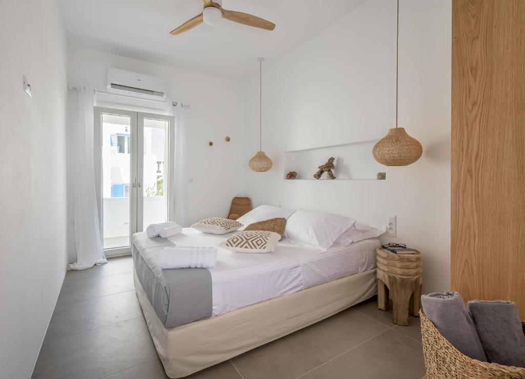 Posteľ alebo postele v izbe v ubytovaní Elyos Apartments