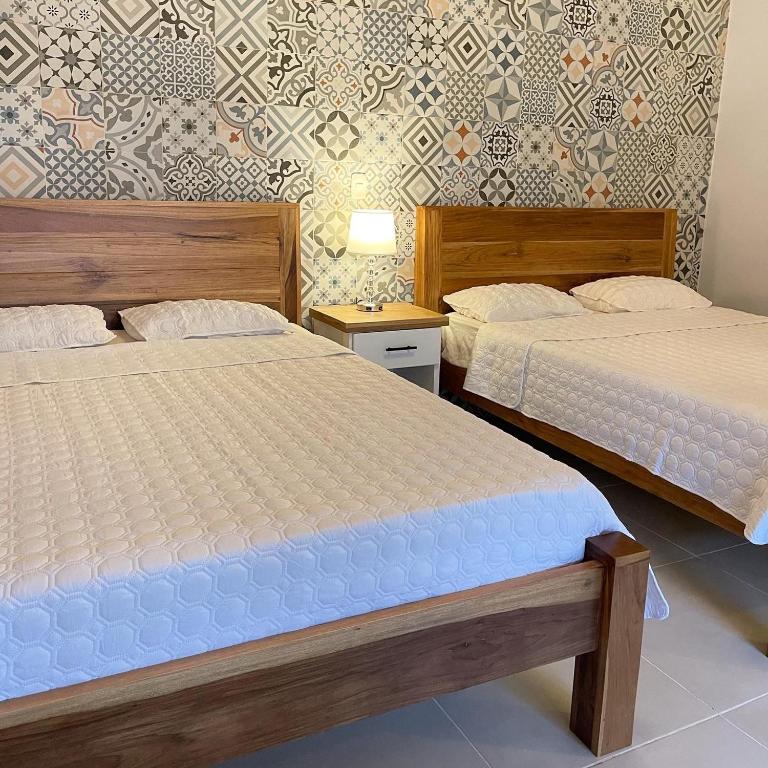Postel nebo postele na pokoji v ubytování Hotel Mono Azul