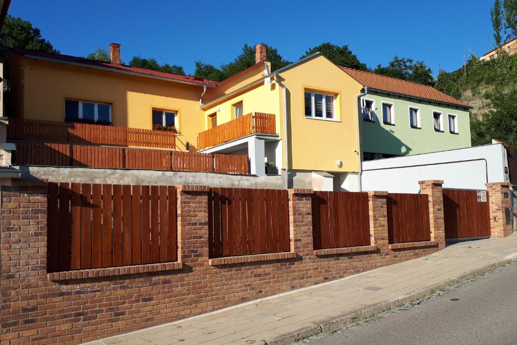 a brick fence in front of a house at Domek u Dyje in Znojmo
