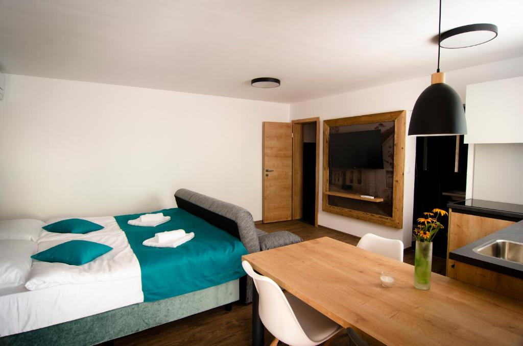 Postel nebo postele na pokoji v ubytování Apartments with Private Saunas & WELLNESS Gobi