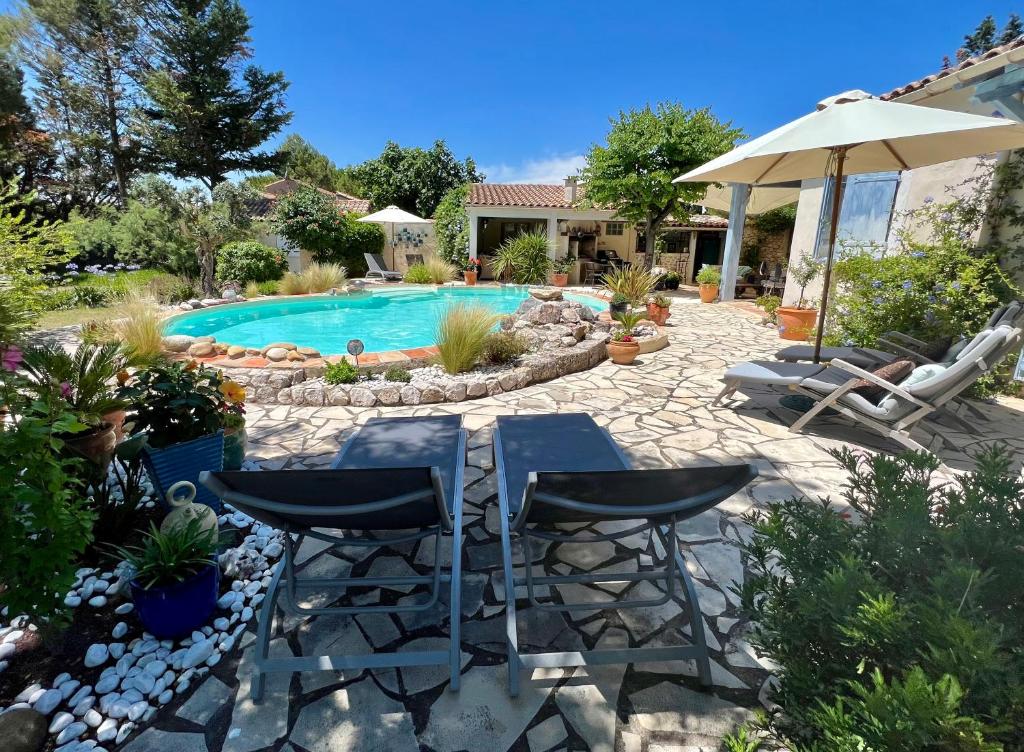 The swimming pool at or close to La Bergerie De Laval