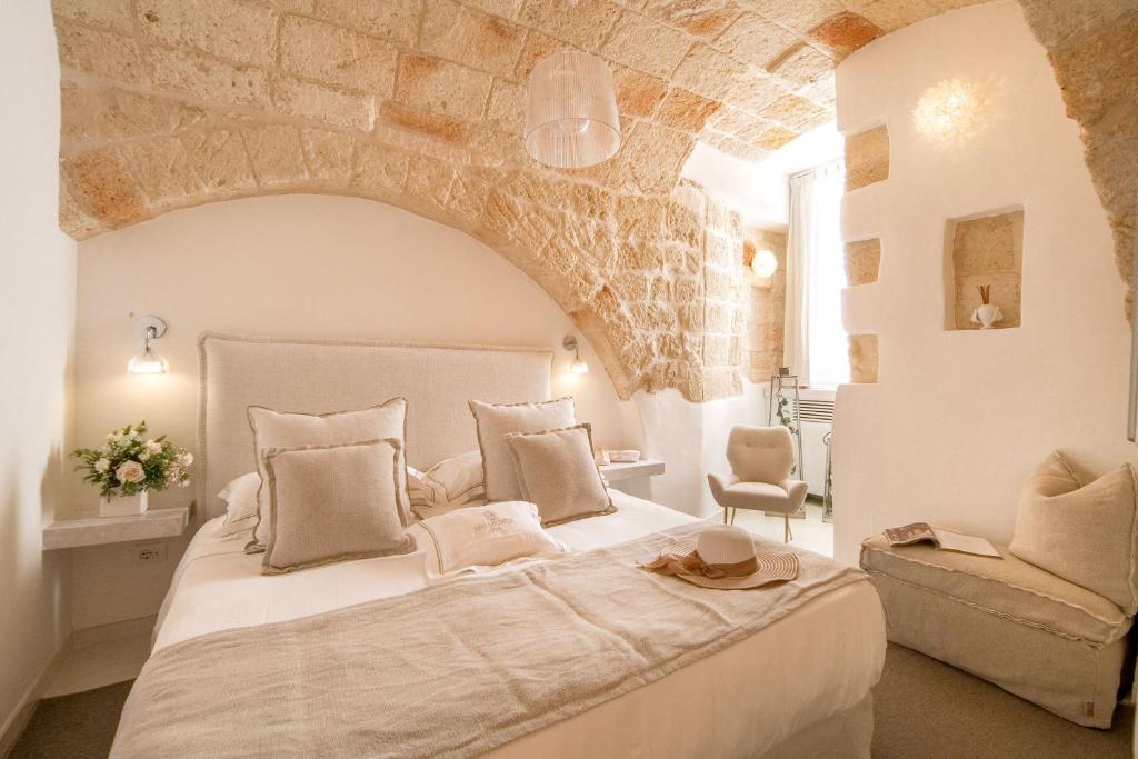 Postel nebo postele na pokoji v ubytování San Michele Suite